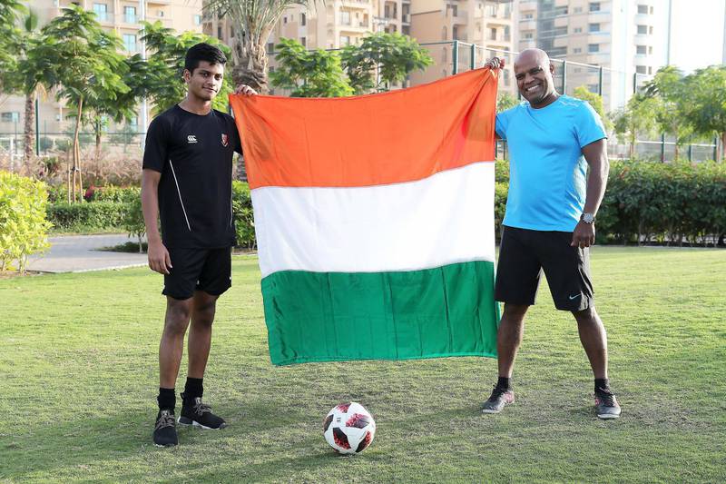 DUBAI , UNITED ARAB EMIRATES , January 9 – 2019 :- Indian football fans Cris Clive with his father Laurel Clive at the park in Dubai Silicon Oasis in Dubai. ( Pawan Singh / The National ) For News. Story by Ramola