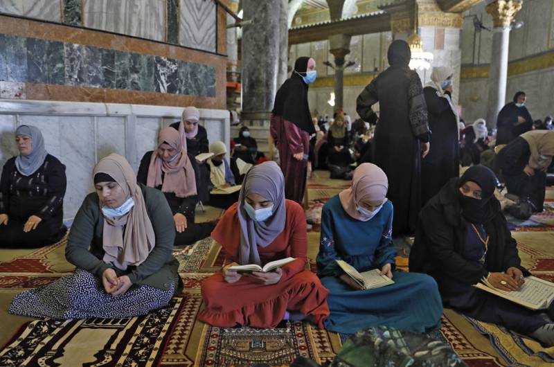 Palestinian women pray at the mosque during Ramadan last year. AFP