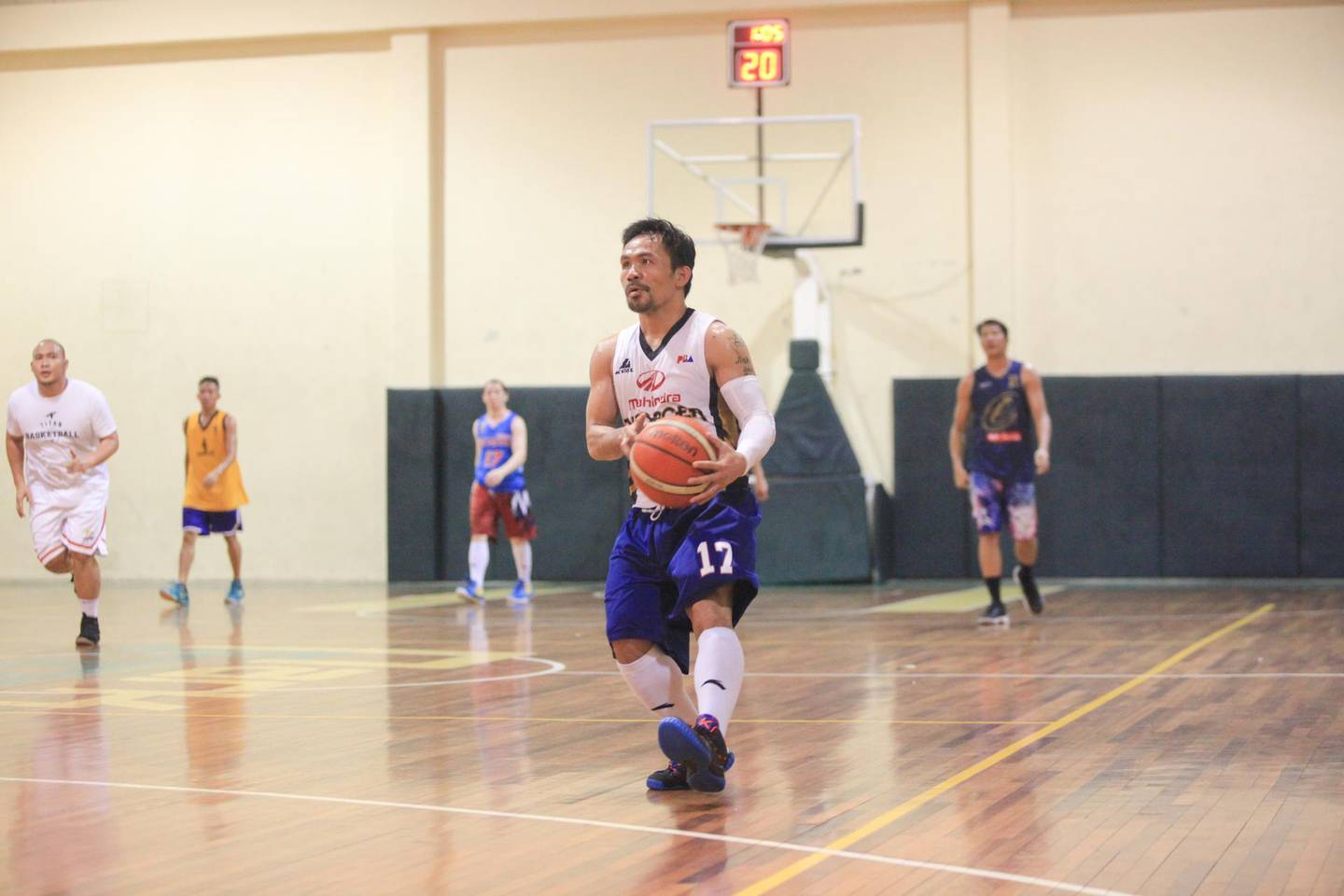 Manny Pacquiao spent the night before his office Christmas party on the basketball court, playing four full games. Jake Verzosa for The National