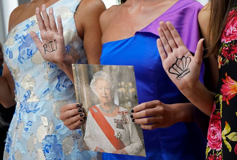 Models pay tribute to Queen Elizabeth II at the Sohuman show. AFP