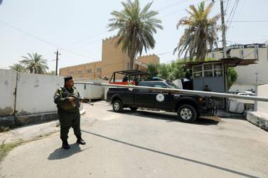 Iraqi security forces stand guard outside the Bahraini embassy in Baghdad, Iraq. Reuters 