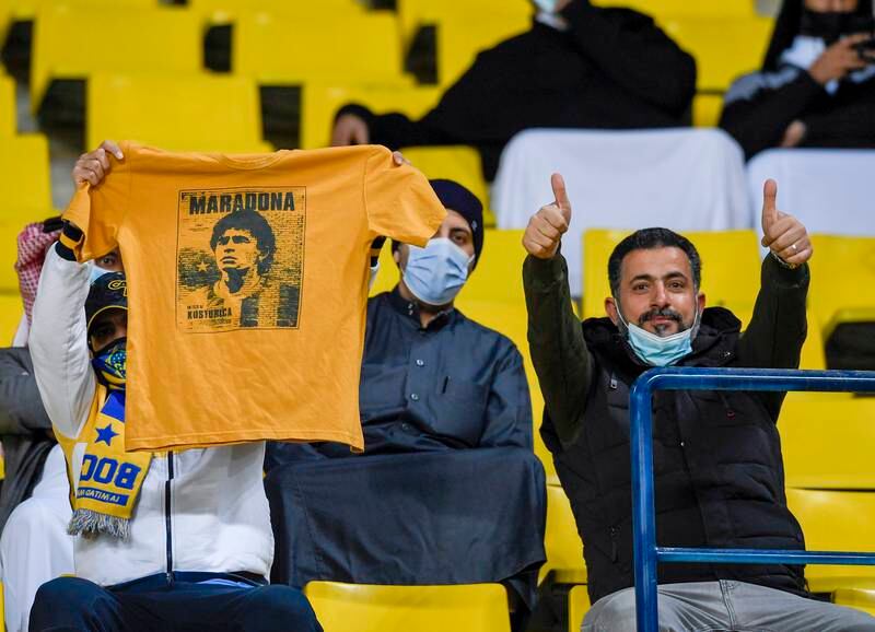 Fans at the Marsool Park Stadium in Riyadh before kick-off of the Maradona Cup match between Boca Juniors and Barcelona in tribute to Diego Maradona who passed away in November 2020. EPA