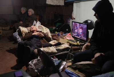 Local residents shelter in the basement of a residential building amid shelling in Lysychansk, in the Luhansk region. AFP