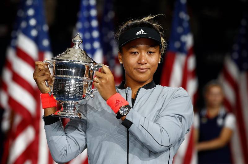 NEW YORK, NY - SEPTEMBER 08: Naomi Osaka of Japan poses with the championship trophy after winning the Women's Singles finals match against Serena Williams of the United States on Day Thirteen of the 2018 US Open at the USTA Billie Jean King National Tennis Center on September 8, 2018 in the Flushing neighborhood of the Queens borough of New York City.   Julian Finney/Getty Images/AFP
== FOR NEWSPAPERS, INTERNET, TELCOS & TELEVISION USE ONLY ==
