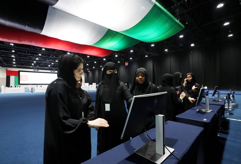 Abu Dhabi, United Arab Emirates - October 01, 2019: People are taught how to use the system (not voting). Early FNC voting takes place. Tuesday the 1st of October 2019. ADNEC, Abu Dhabi. Chris Whiteoak / The National