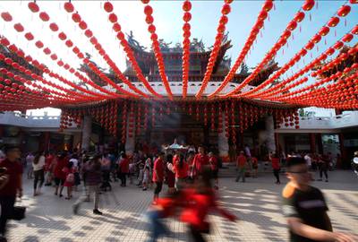 Visitors gather under traditional Chinese lanterns at a temple in Kuala Lumpur, Malaysia. AP Photo