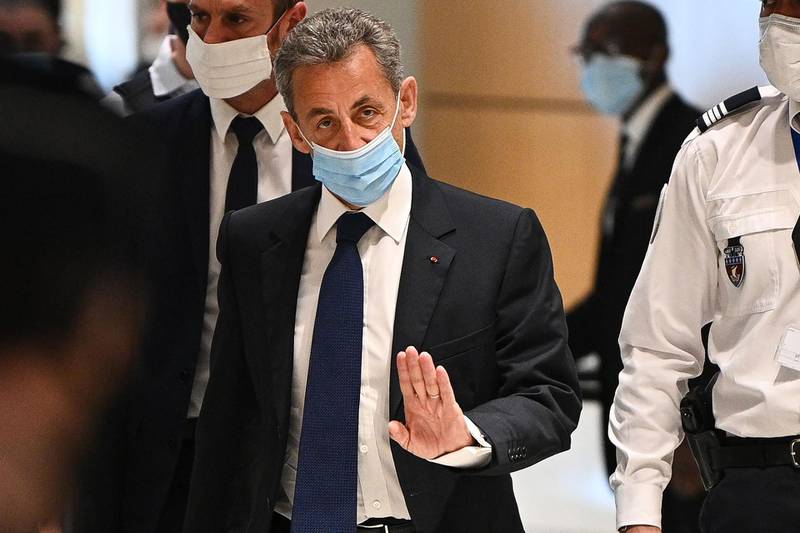 Former French president Nicolas Sarkozy arrives at the Paris court house to hear the final verdict in a corruption trial. AFP