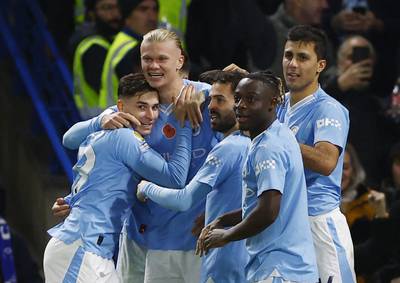 Manchester City's Erling Haaland celebrates scoring their third goal with teammates. Action Images