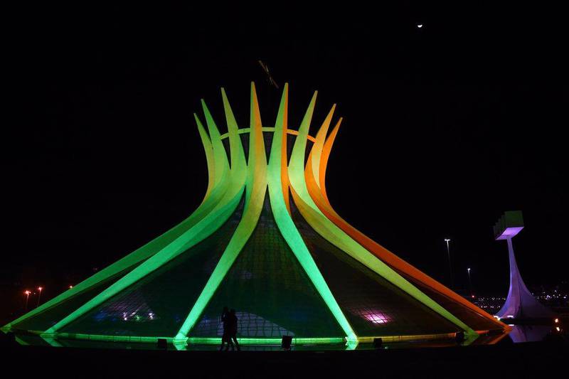 View of Brasilia's Metropolitan Cathedral illuminated in green and yellow on Wednesday. Evaristo SA / AFP / June 4, 2014