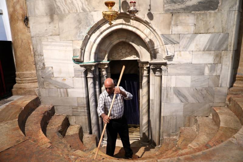 A man cleans at the Church of the Nativity on November 27, the first day of the Christmas season's festivities, in the West Bank city of Bethlehem. EPA