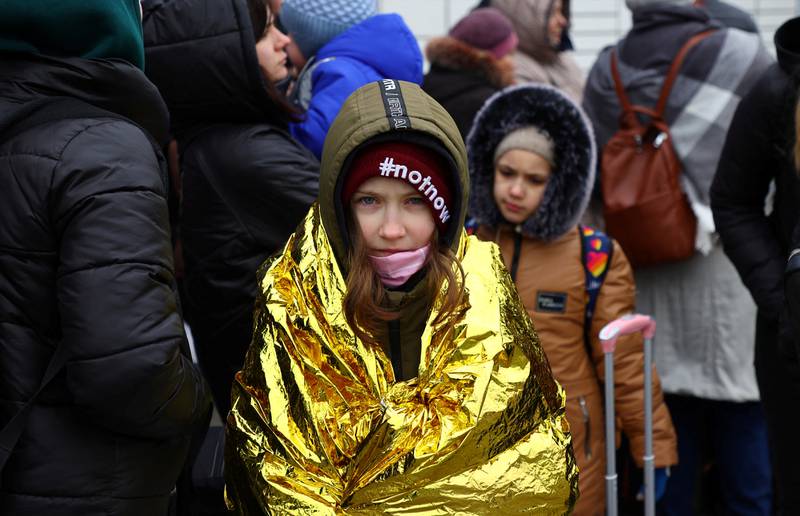 Refugees who fled Ukraine wait outside a temporary centre in Przemysl, Poland. Reuters