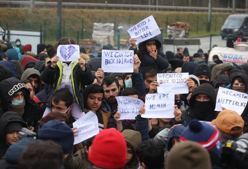 People demanding permission to get to EU during a rally on the territory of the transport and logistics center 'Bruzgi' near the the Bruzgi checkpoint at the Belarusian-Polish border, in the Grodno region, Belarus, 25 November 2021.  Asylum-seekers, refugees and migrants from the Middle East arrived at the Belarusian-Polish checkpoint of Bruzgi-Kuznica aiming to cross the border. EPA