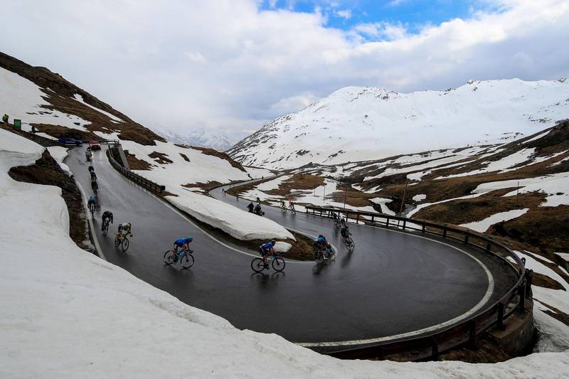 Riders descend after crossing the Splugen Pass during Stage 20. AFP