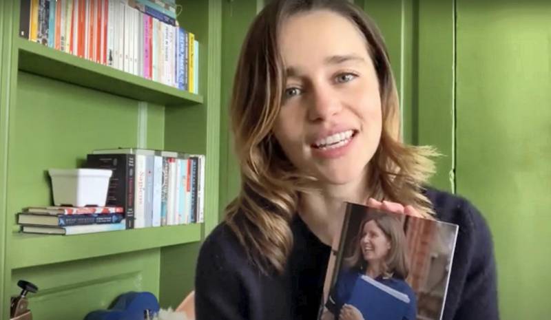 Emilia Clarke in the video that appears on the website of her SameYou charity, holding a picture of  her "supernurse" known only as Tina