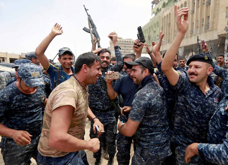 Iraqi Federal police celebrate in the Old City of Mosul and ISIL looked close to defeat