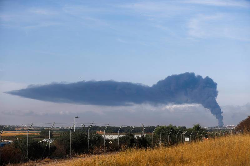 Smoke rises as a result of Israeli air strikes against Hamas targets as seen from the Israeli side of the border to the Gaza strip on 17 May. EPA