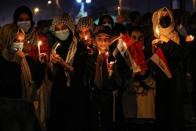 Demonstrators light candles to mark the first anniversary of the anti-government protests in Basra, Iraq. AP Photo