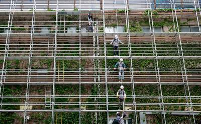 People work at a construction site in downtown Seoul, South Korea. AP Photo