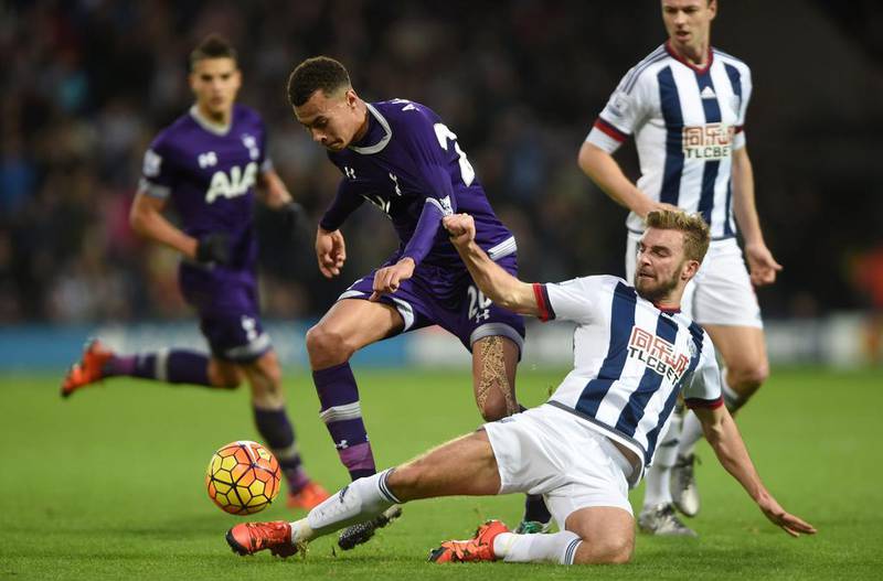 West Bromwich Albion’s James Morrison, right, and Tottenham Hotspur’s Dele Alli battle for the ball during their English Premier League soccer match at The Hawthorns, West Bromwich, England, Saturday, Dec. 5, 2015. (Joe Giddens/PA via AP)