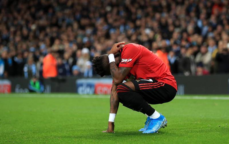 Manchester United's Fred reacts after being hit by thrown objects. PA