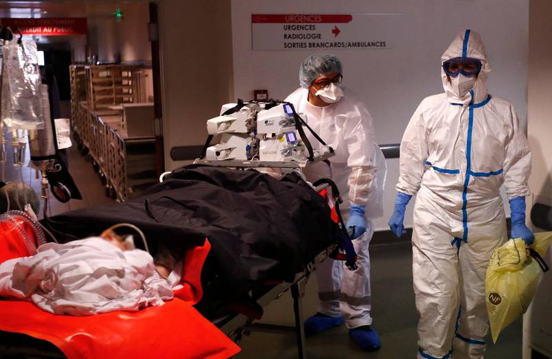 Hospital staff carry a Covid-19 patient at the Clinic du Millenaire, in Montpellier, France. EPA