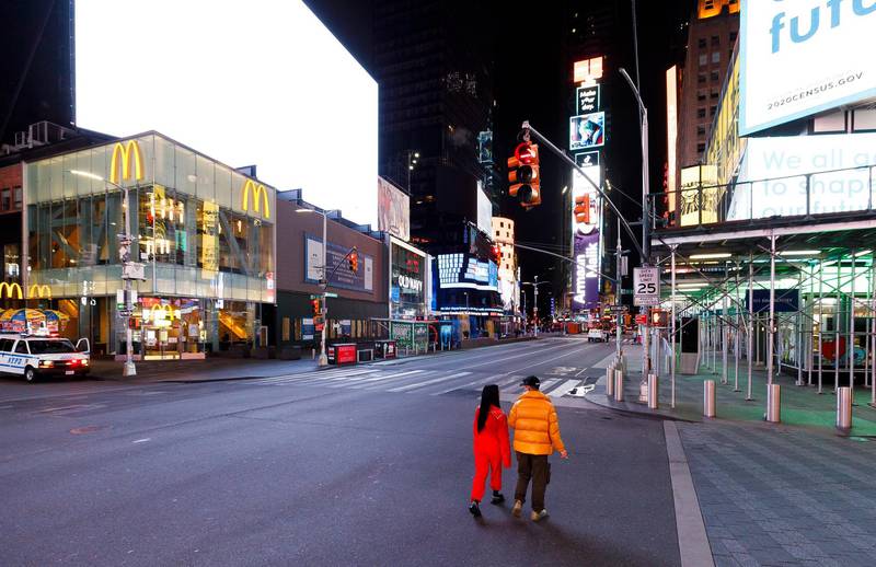 People walk through a nearly empty Times Square in New York, USA.  EPA
