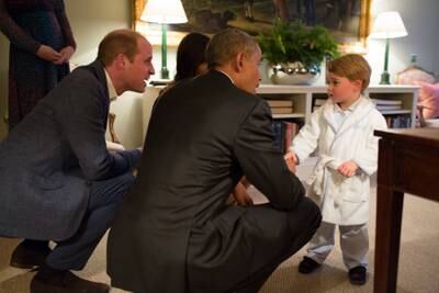 Mr Obama speaks with Prince George in London. The White House / Getty Images
