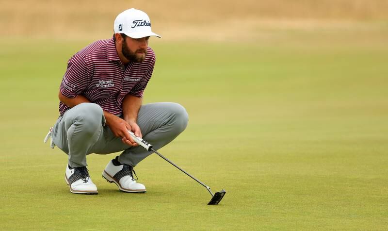 Cameron Young of the United States lines up a putt on the 10th green. Getty