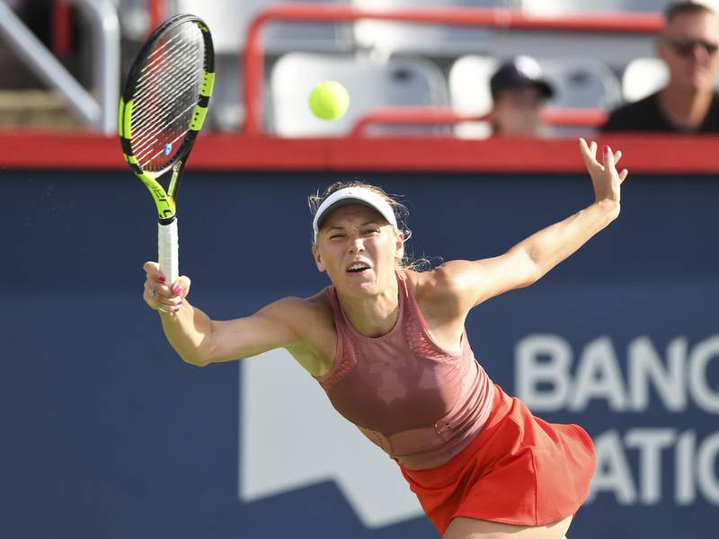 MONTREAL, QC - AUGUST 09: Caroline Wozniacki of Denmark hits a return against Aryna Sabalenka of Belarus during day four of the Rogers Cup at IGA Stadium on August 9, 2018 in Montreal, Quebec, Canada.   Minas Panagiotakis/Getty Images/AFP
== FOR NEWSPAPERS, INTERNET, TELCOS & TELEVISION USE ONLY ==
