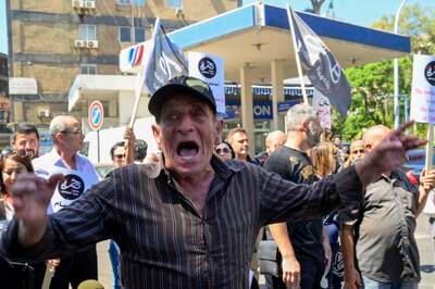 Protesters rally in support of a bank customer who took staff hostage in Beirut, in a bid to access his savings, amid Lebanon's economic crisis. EPA