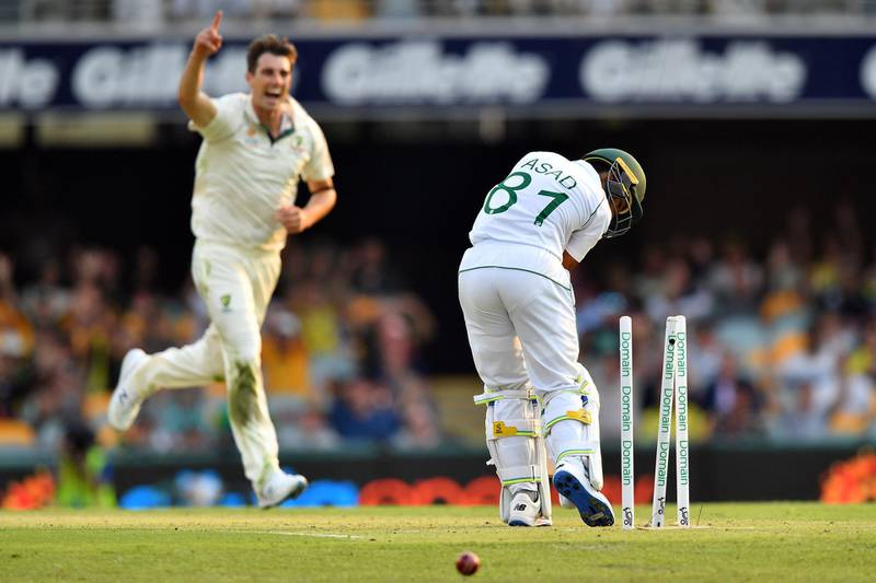 Australia bowler  Pat Cummins celebrates after bowling Pakistan's Asad Shafiq. AFP