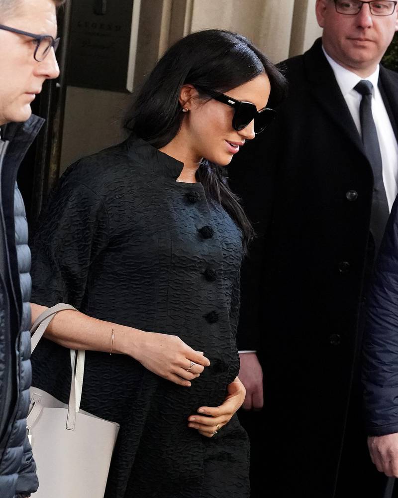Meghan, Duchess of Sussex, in a vintage Courreges coat, exits a hotel in New York on February 19, 2019. Reuters