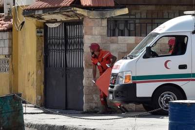 Palestinian emergency personnel approach the entrance of Ain Al Hilweh refugee camp in Lebanon, where clashes have erupted. EPA