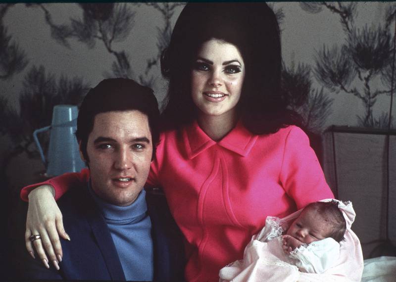 FILE -Elvis Presley poses with wife Priscilla and daughter Lisa Marie, in a room at Baptist hospital in Memphis, Tenn. , on Feb.  5, 1968.  Lisa Marie Presley, a singer, Elvis’ only daughter and a dedicated keeper of her father’s legacy, died Thursday, Jan.  12, 2023 after being hospitalized for a medical emergency.  (AP Photo / File)
