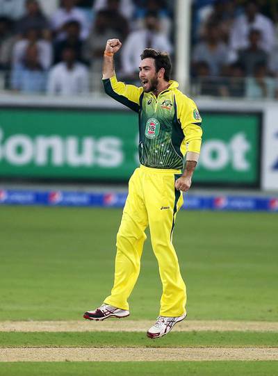 Glenn Maxwell celebrates after taking the wicket of Umar Amin in Dubai on Sunday night. Pawan Singh / The National