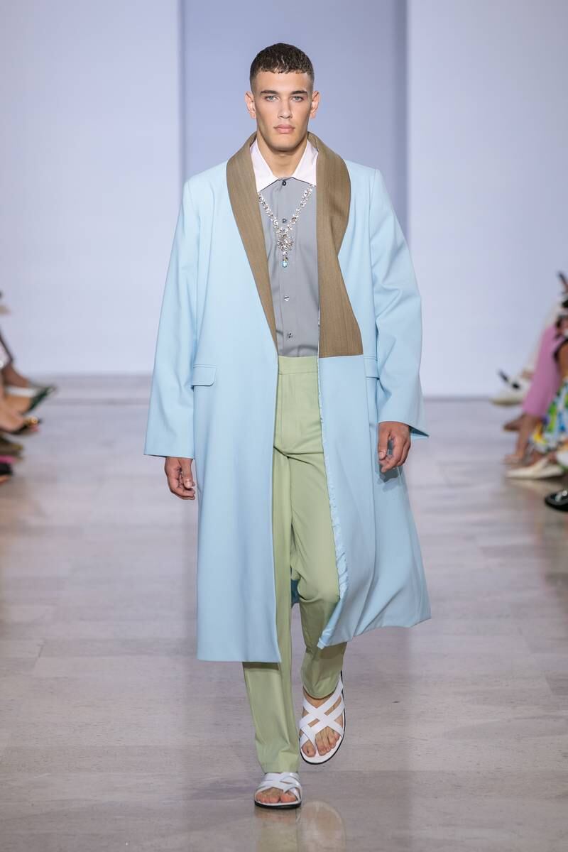 The collection's restrained use of colour is evident in this menswear look.