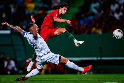 Portugal's forward Joao Felix (R) vies with Luxembourg's defender Maxime Chanot during the Euro 2020 qualifier group B football match between Portugal and Luxembourg at the Jose Alvalade stadium in Lisbon.  AFP