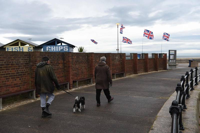 People walk along by Union Flags flying in Sunderland, northeast England. AFP