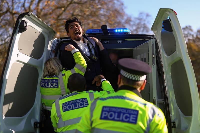 A man is detained by the police as he attempts to talk on Speakers' Corner in Hyde Park in London. Reuters