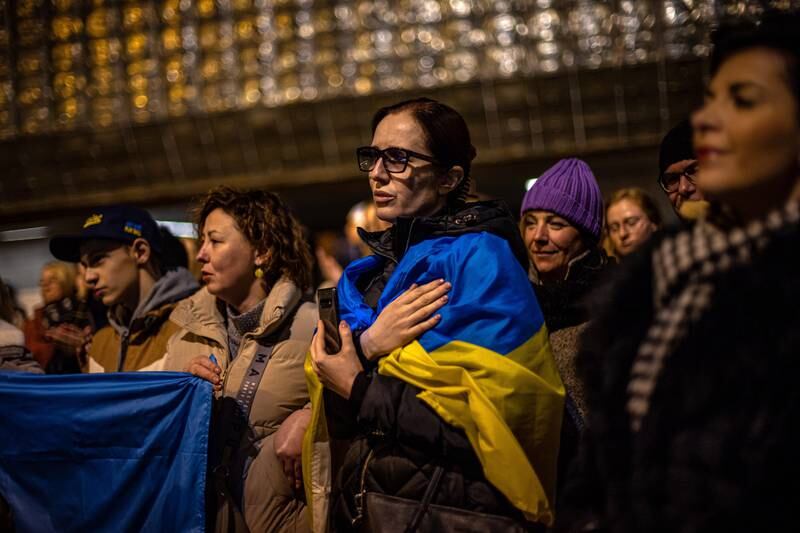 A woman expresses her solidarity with Ukraine at the Czech National Theatre, in Prague. EPA