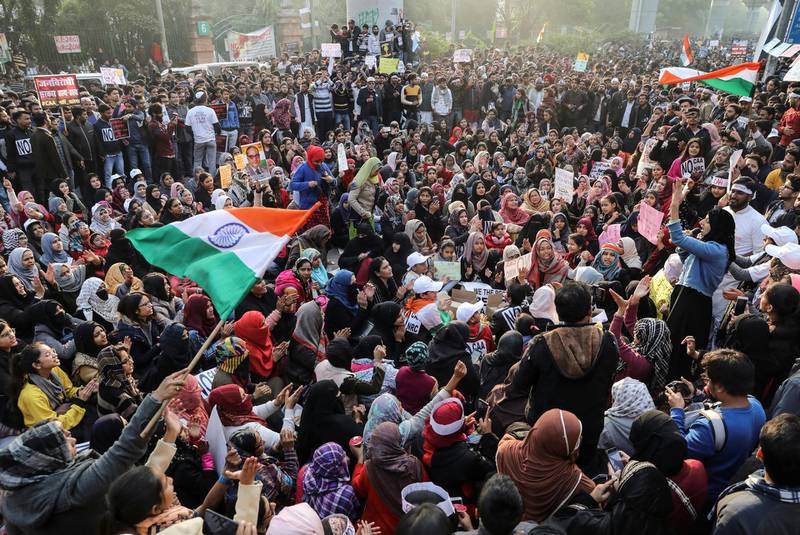 Demonstrators attend a protest against a new citizenship law, outside the Jamia Millia Islamia University in New Delhi, India, December 21, 2019. REUTERS/Anushree Fadnavis