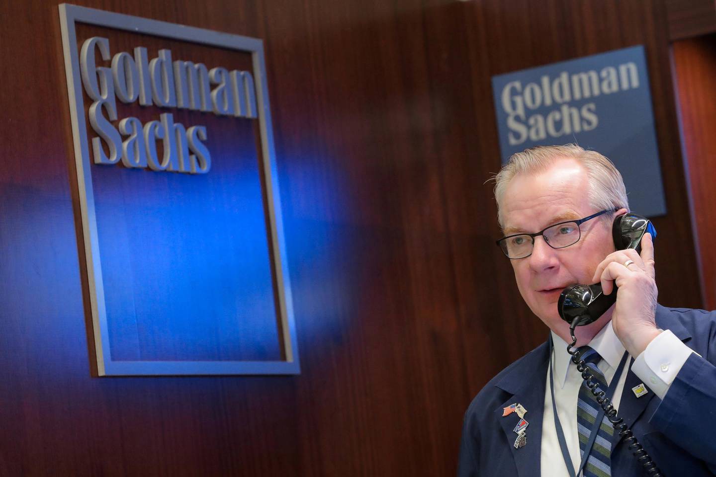 FILE PHOTO: A trader works inside the Goldman Sachs booth on the floor of the New York Stock Exchange (NYSE) in New York, U.S., March 7, 2019. REUTERS/Brendan McDermid/File Photo