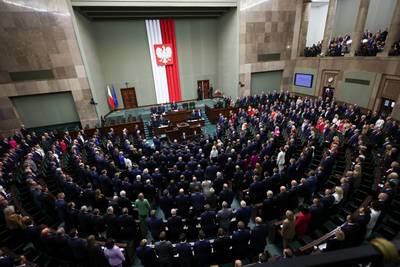 Members sing the national anthem during the first session of the newly elected Polish parliament in Warsaw. Reuters