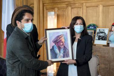 Ahmad Massou and Paris Mayor Anne Hidalgo hold up a portrait of late Afghan commander Ahmad Shah Massoud. Courtesy Office of Paris Mayor