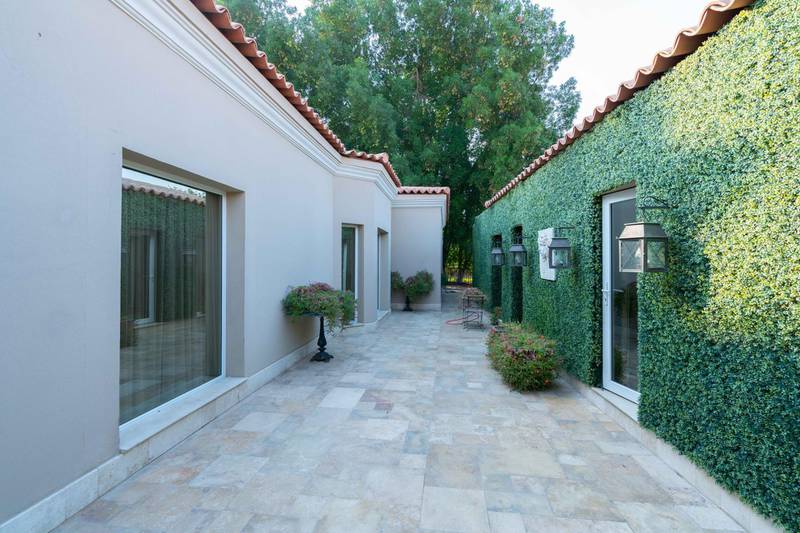 Boundary walls have been covered to look like a classic garden maze. Courtesy Luxury Property