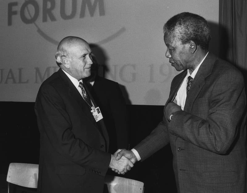 Former South African president FW de Klerk shakes hands with South African anti-apartheid leader Nelson Mandela in Davos in 1992. World Economic Forum