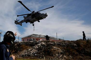 A Royal Navy helicopter takes off outside Marsh Harbour Healthcare Centre as international relief for the hurricane-hit islands arrived on Friday. Reuters