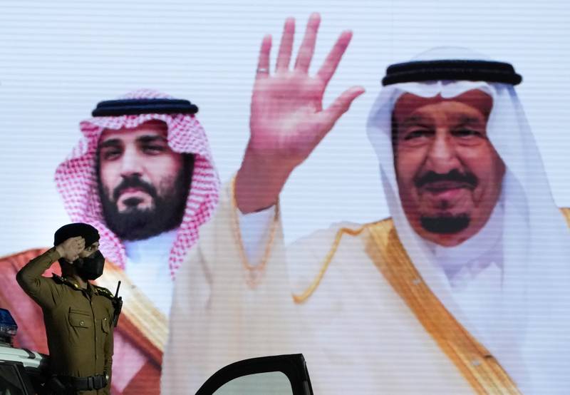 A salute for King Salman and Crown Prince Mohammed bin Salman, depicted on a giant poster. A million Muslims are expected to attend this year's Hajj after two years of pandemic disruption. AP Photo