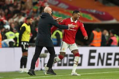 Manchester United manager Erik ten Hag and Marcus Rashford celebrate after winning the League Cup final. AP 