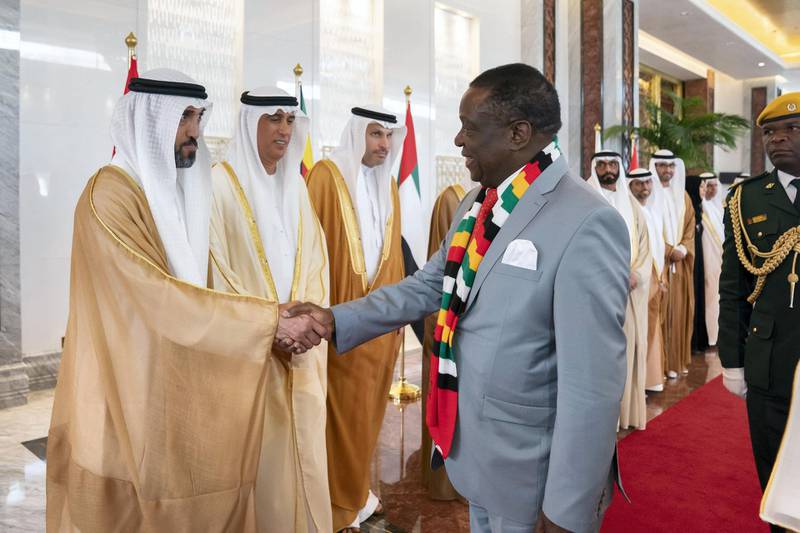 ABU DHABI, UNITED ARAB EMIRATES - March 16, 2019:  HE Mohamed Mubarak Al Mazrouei, Undersecretary of the Crown Prince Court of Abu Dhabi (L) greets HE Emmerson Mnangagwa, President of Zimbabwe (R), during a reception at the Presidential Airport. 

( Ryan Carter for the Ministry of Presidential Affairs )
---